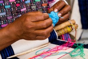 Mayan weaver creating a tail we could wag handmade dog collar